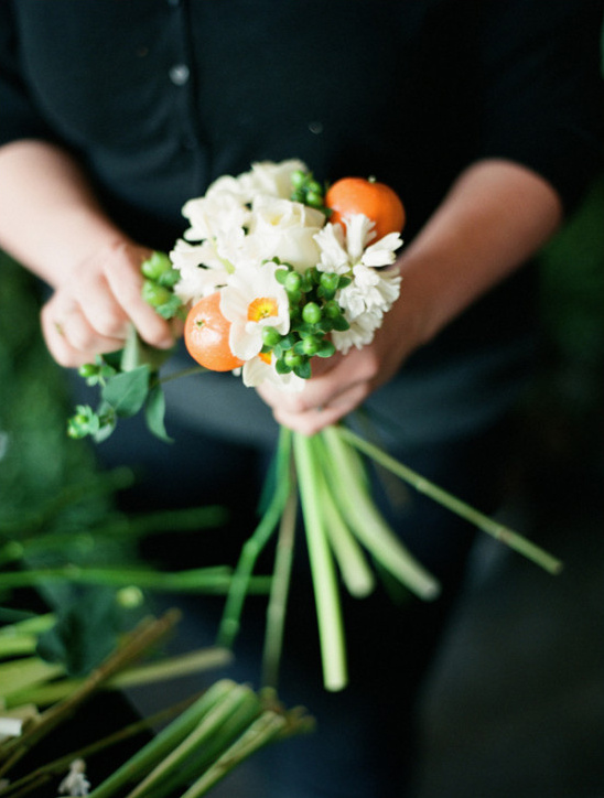 white and orange bouquet assembly