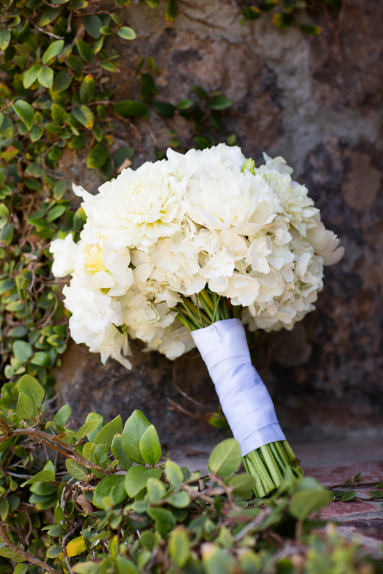 Bridal bouquet of white flowers and silk ribbon wrap