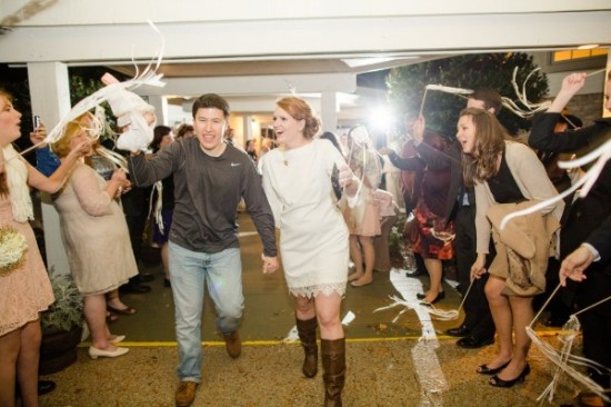 Newly married couple celebrates with a confetti exit at their wedding