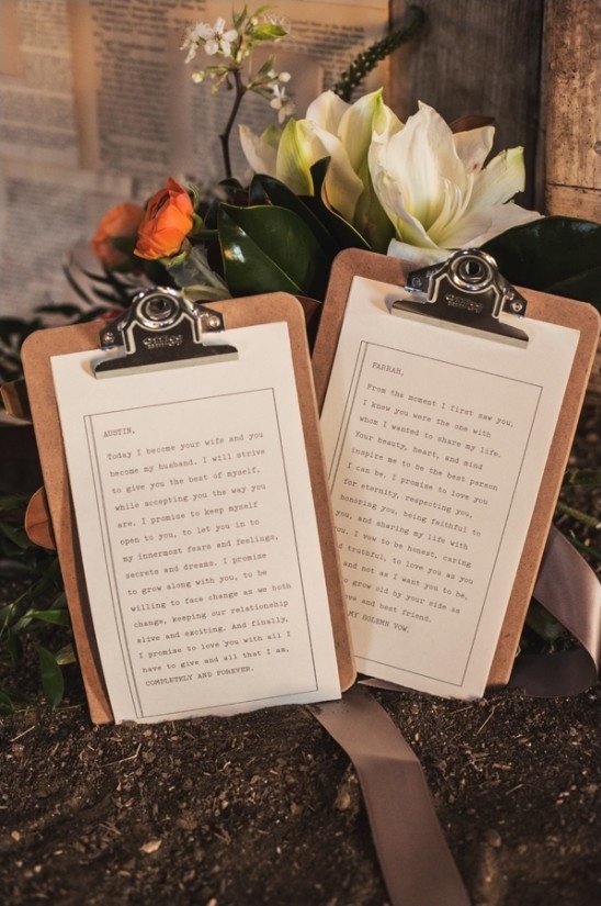 Wedding vows on clipboards with floral accents