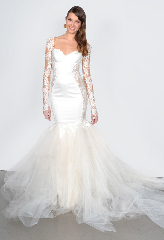 Elegant bride in a mermaid wedding dress with lace sleeves