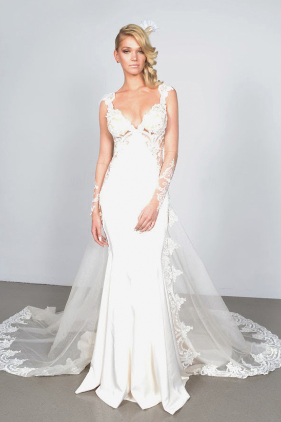 Elegant bride in a white wedding gown with lace detailing