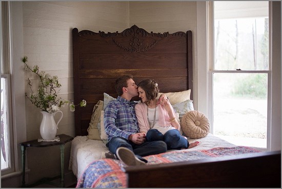 Couple in love sitting on bed, romantic moment at home