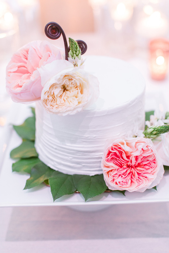 simple wedding cake with garden rose accents