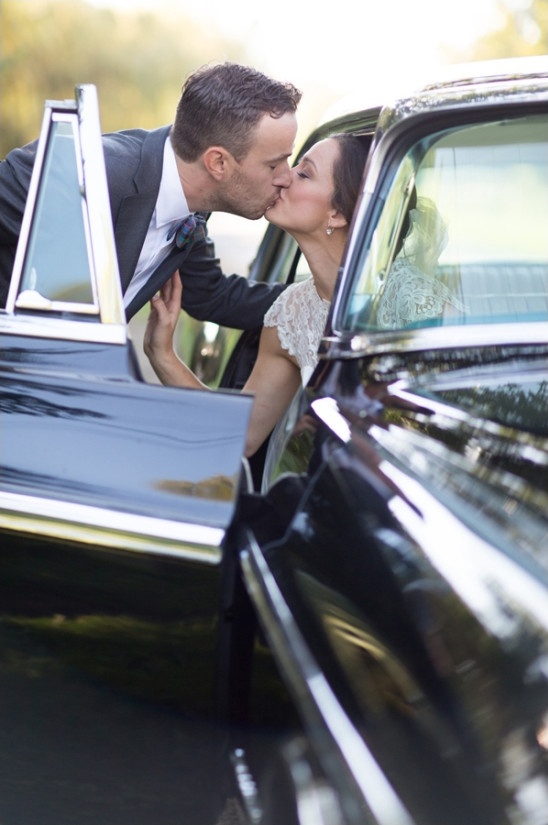 classic car wedding kiss