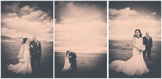 Romantic wedding couple in a field with cloudy sky landscape