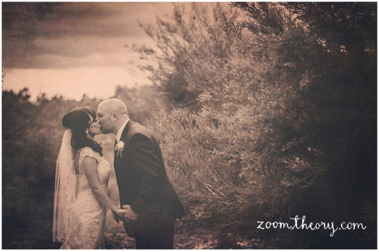 Bride and groom share a tender kiss on their wedding day
