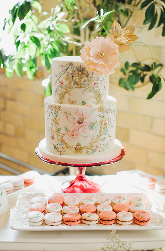 Two tier floral wedding cake with macarons