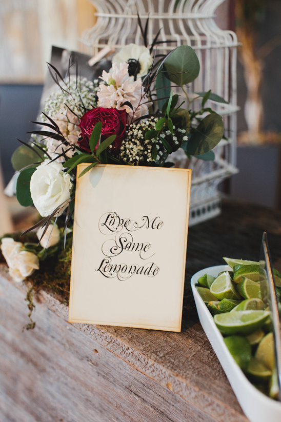 Love Me Some Lemonade sign with lime and flowers