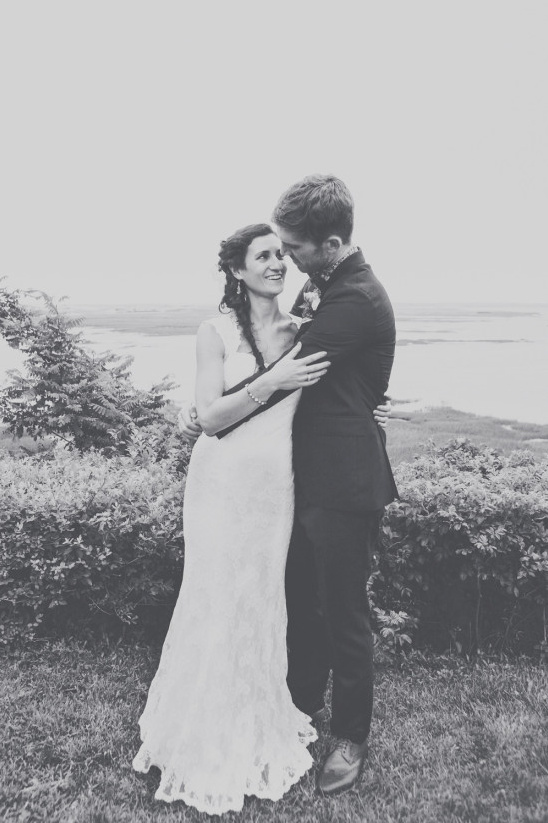 Romantic black and white wedding photo of a loving couple embracing