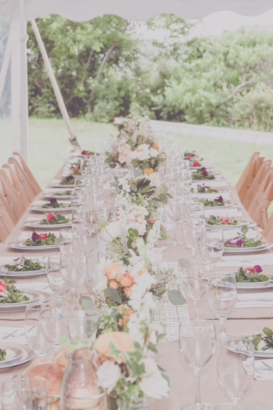 Long table set for a wedding with floral centerpieces