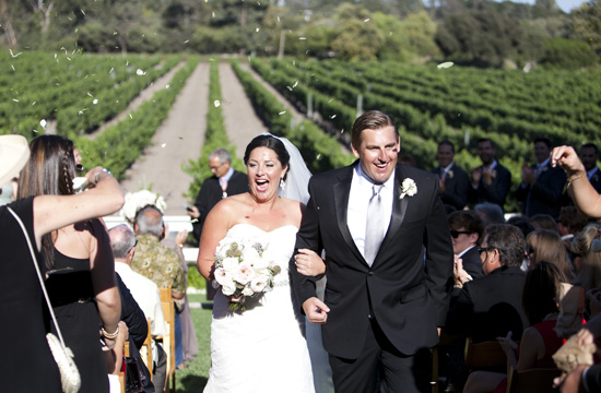 Newlyweds excited after wedding ceremony, confetti celebration