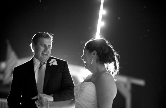 Joyful bride and groom laugh during their wedding ceremony