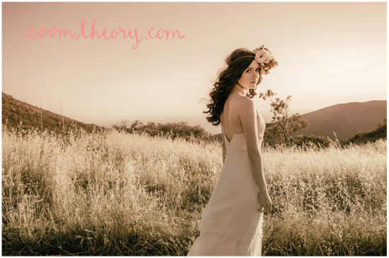Woman in a white dress with a flower crown in a field