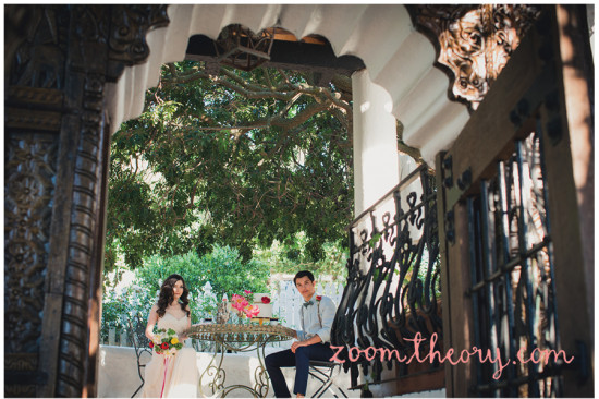 Bride and groom pose in a lush garden setting for a romantic wedding