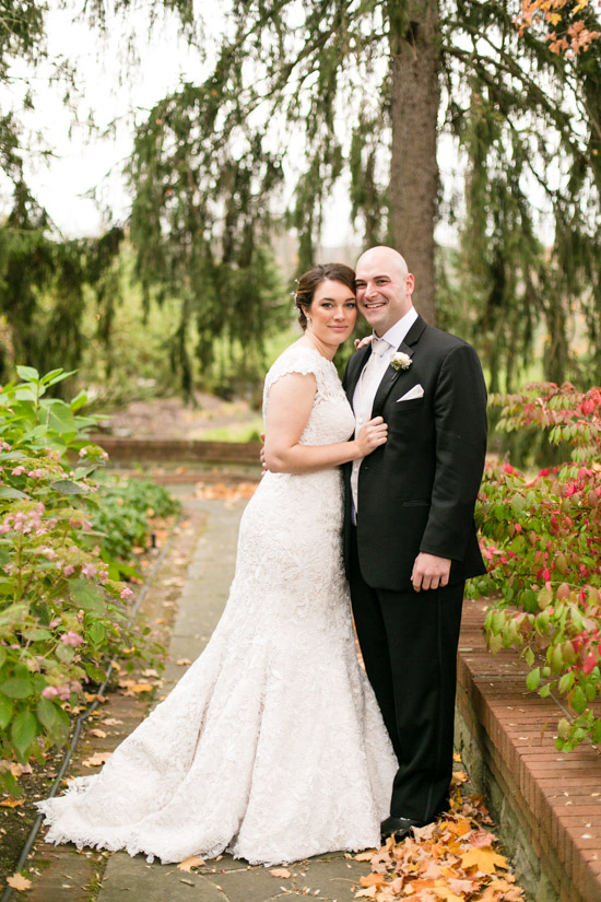Bride and groom pose together on their wedding day