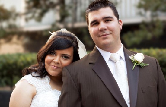 Bride leans on groom at their outdoor wedding day