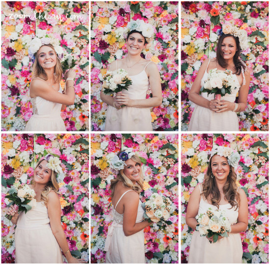 Bridesmaids with flower crowns and bouquets, posing with floral backdrop