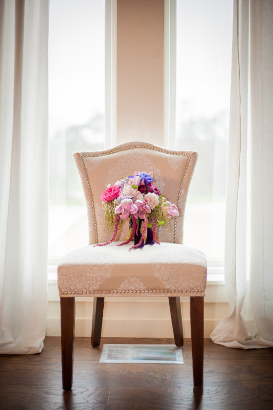 Wedding bouquet on an elegant chair in front of a window