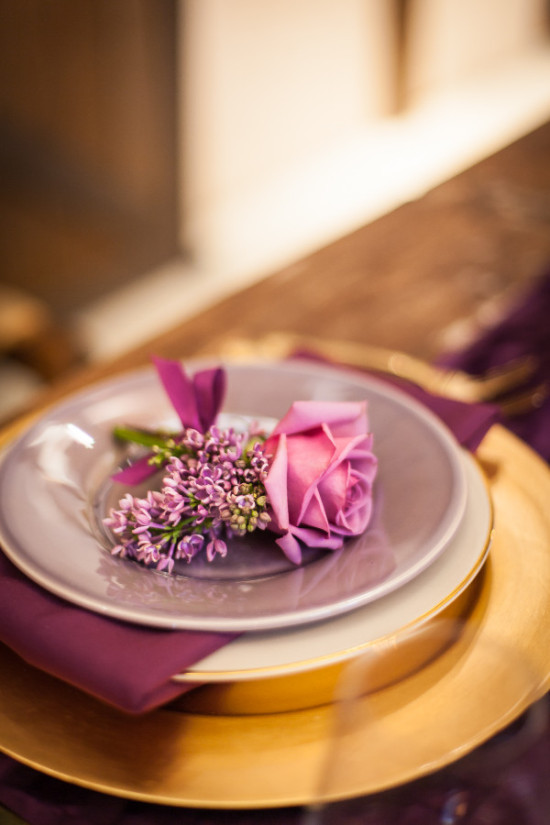 Elegant wedding table setting with rose and lilac flowers