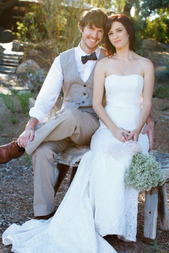 Happy couple on their wedding day, smiling and posing for the photo
