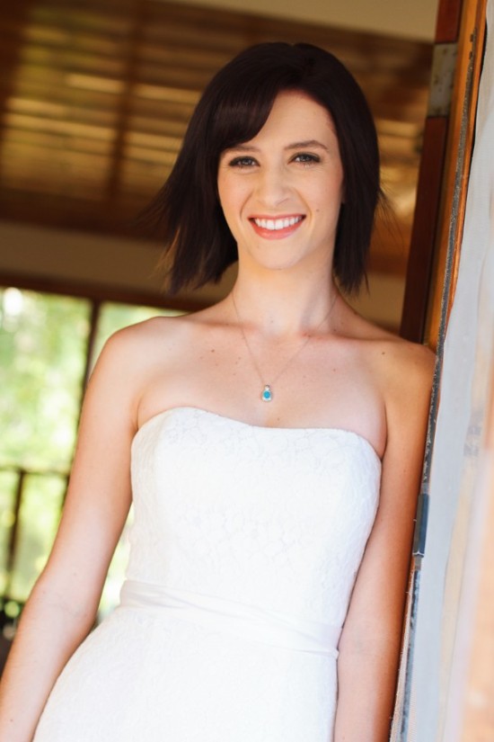 Smiling bride in a white wedding dress, preparing for her big day
