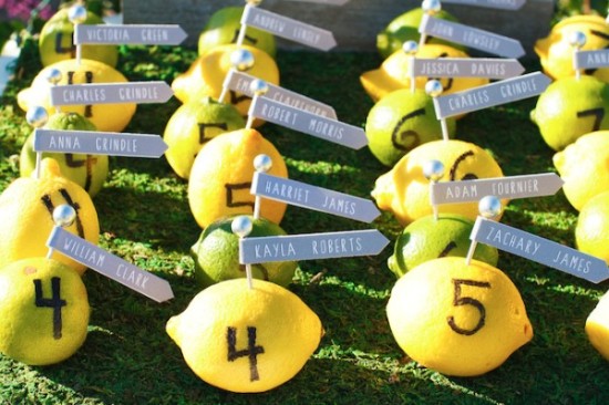 Creative wedding place cards made from lemons with guest names
