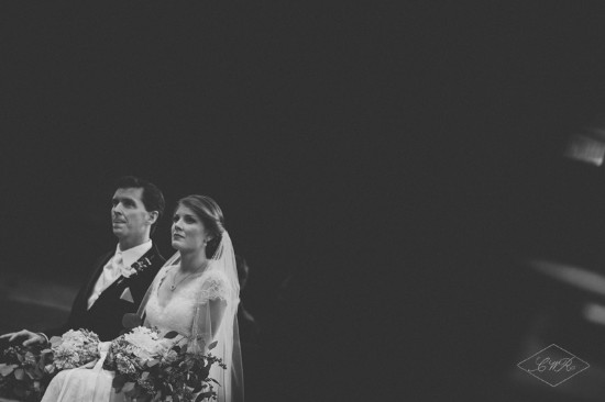 Black and white photo of a bride and groom during their wedding ceremony