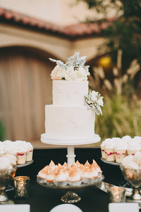 beautiful white flower topped wedding cake