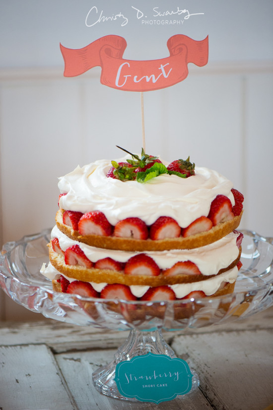 Delicious strawberry shortcake on a decorative glass stand with topper