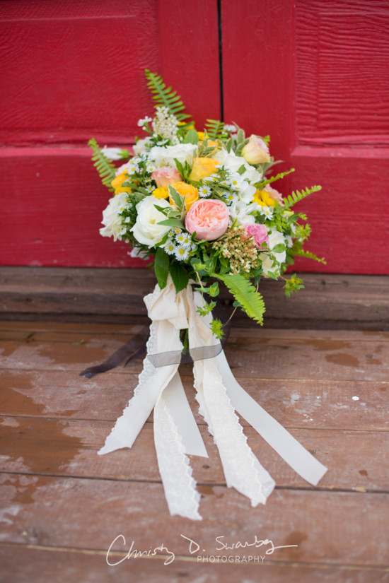 Beautiful wedding bouquet with colorful flowers and ribbons