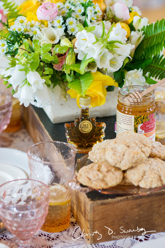 Breakfast spread with biscuits, honey and maple syrup