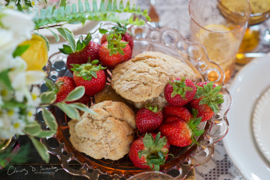 Biscuits and fresh strawberries in a decorative glass bowl