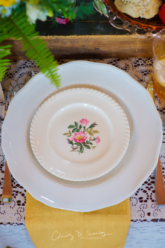 Elegant table setting with floral plate design and yellow napkin