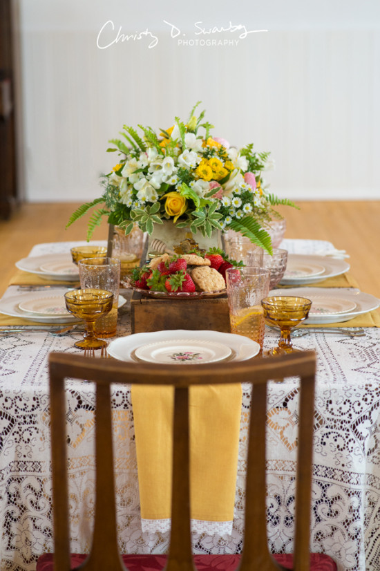 Beautifully decorated table setting with flowers strawberries