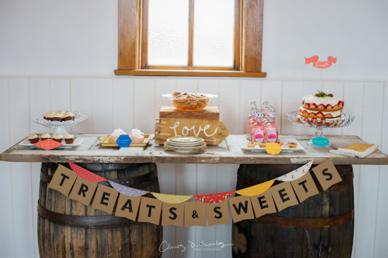 Rustic dessert table with cake pastries and treats