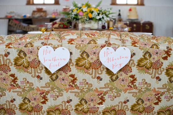 Wedding decor with heart tags, floral background and a romantic touch