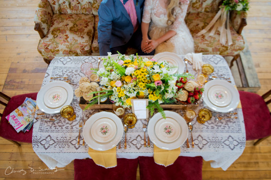 Elegant wedding table setting with floral centerpiece and couple