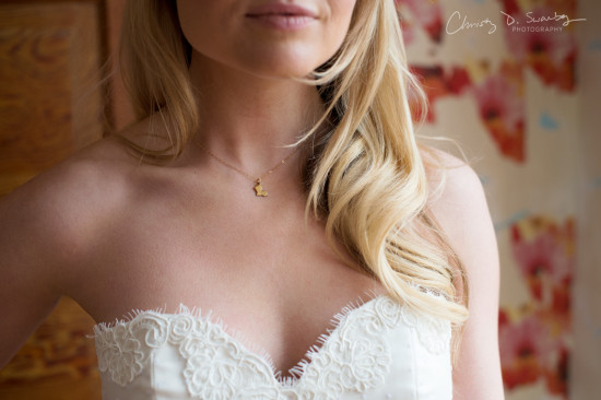 Bride in a white dress and a beautiful necklace closeup view