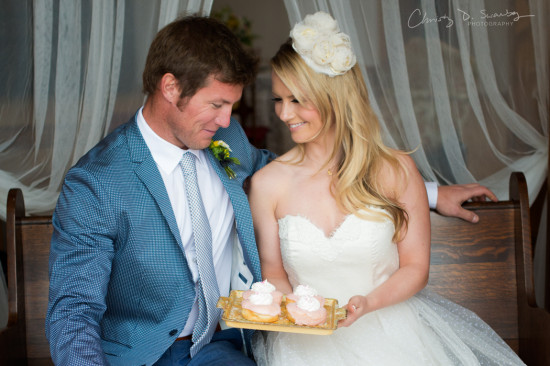 Wedding couple sharing a sweet treat with affection and smiles