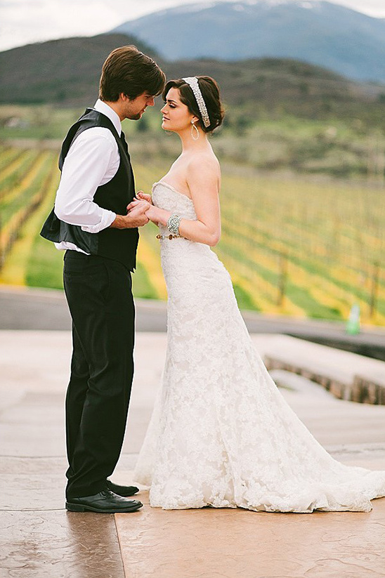 Bride and groom looking at each other, wedding day in vineyard