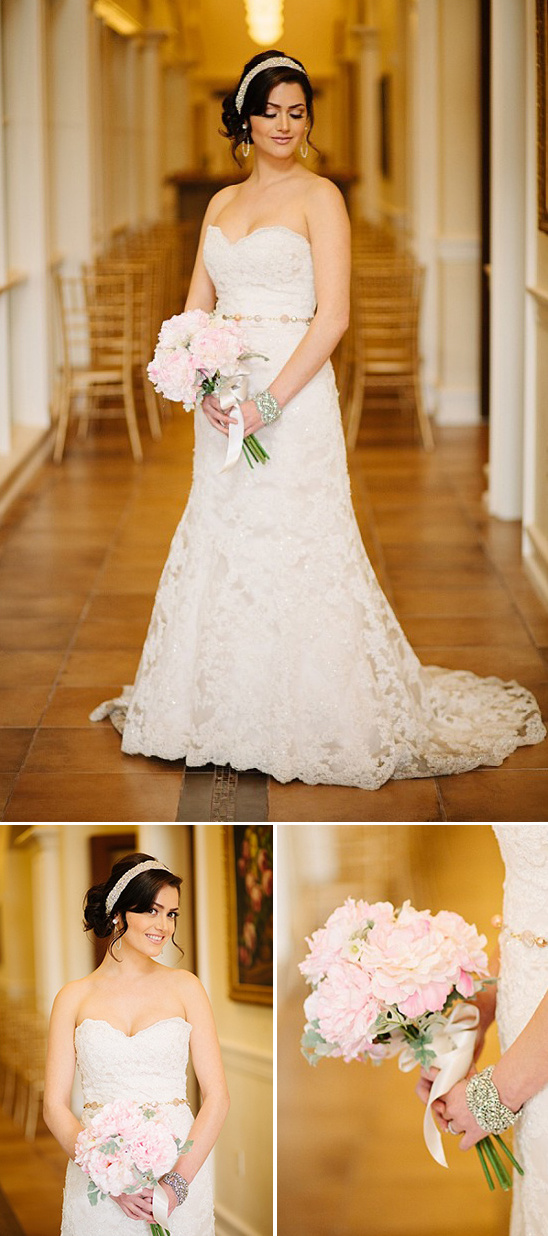Elegant bride in lace wedding gown, holding pink bouquet
