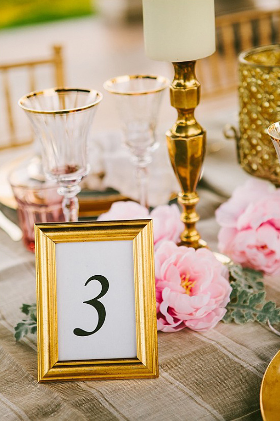 Elegant wedding table decoration with golden frame and number 3