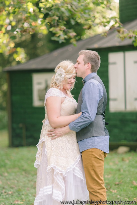 Romantic moment of a bride and groom kissing on their wedding day