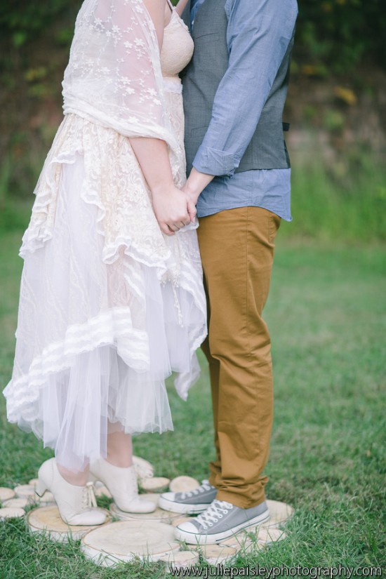 Bride and groom holding hands on wedding day, standing close