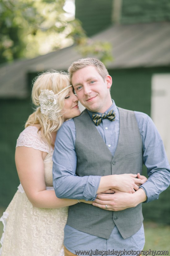 Bride embraces groom on their wedding day outdoors