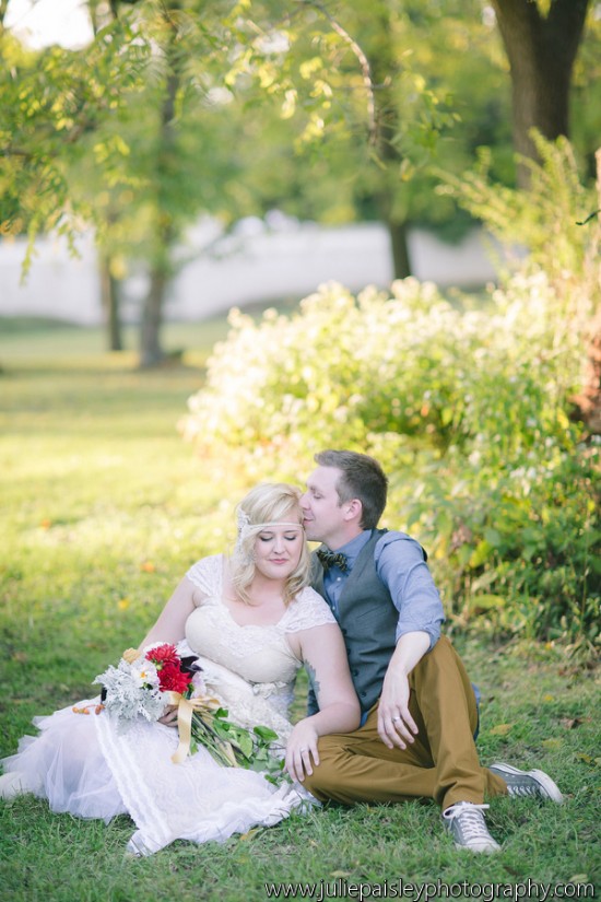 Bride and groom kissing in a garden wedding portrait