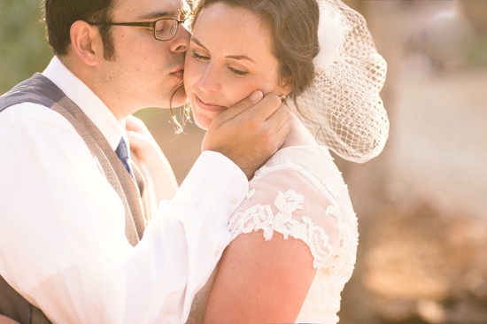 Affectionate moment of a bride and groom, wedding day kiss