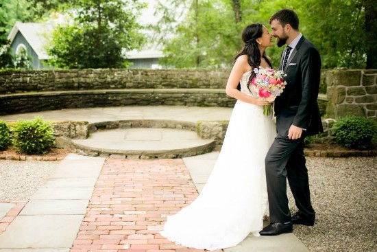 Newlyweds share a tender kiss on their wedding day, full of love