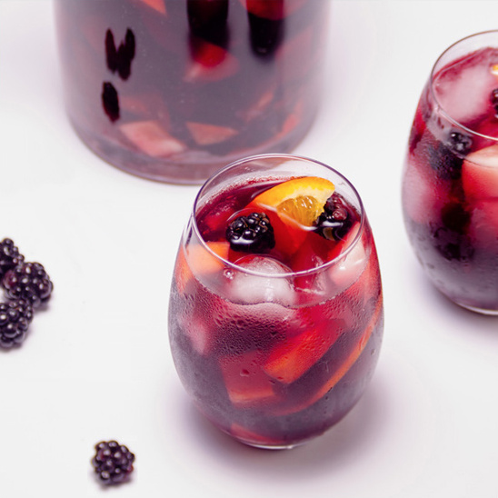 Refreshing Sangria drink with blackberries and orange slices